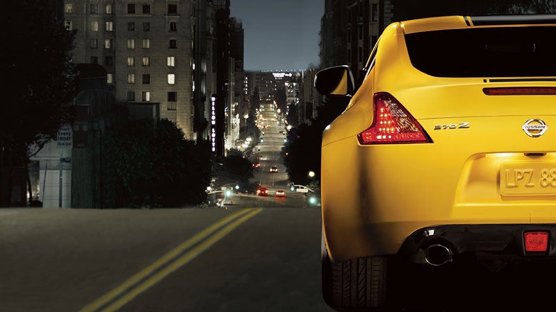 Rear view of a yellow 2019 Nissan 370Z in city